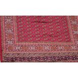 A red ground bokhara carpet, approx 280 x 200cm.