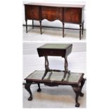 A mahogany reproduction serpentine outlined sideboard, a coffee table and a small leather topped