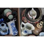 Two boxes of ceramics to include a Poole Pottery jardinière, blue and white jugs and vases and a