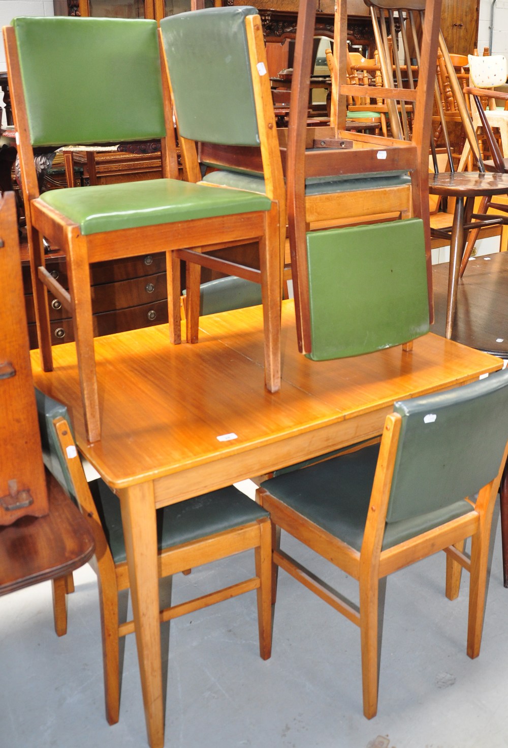 A Gordon Russell of Broadway eight piece dining room suite comprising table, six chairs and