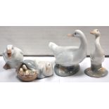 Four Lladro geese, one with goslings in basket at her side.