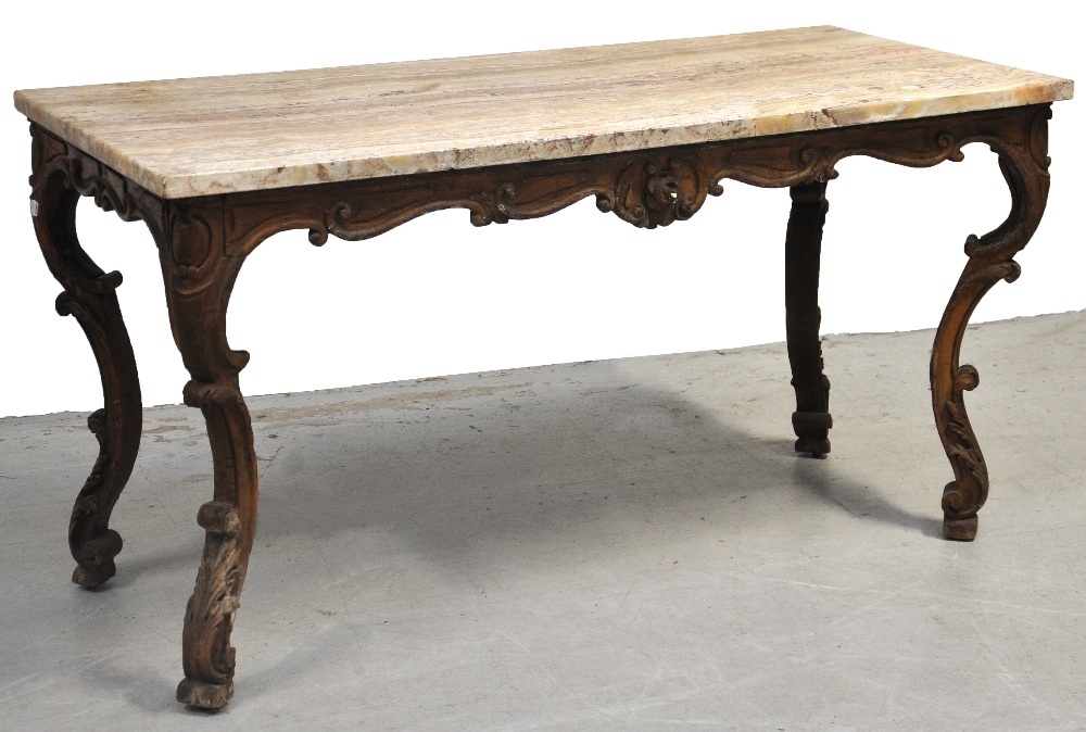 An 18th century Italian centre table, the rectangular onyx top above C scroll all round decorated