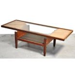 A retro 1970s light oak glass topped rectangular coffee table, the glass raised on curved wooden