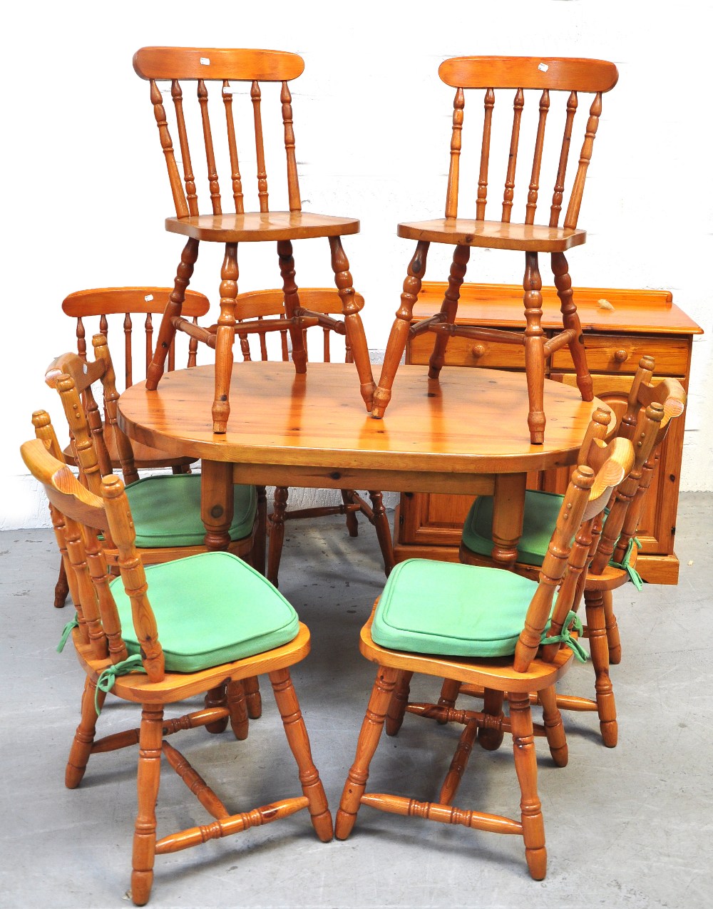 A modern pine table, eight modern pine bar back chairs and a sideboard (10).