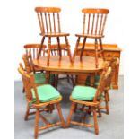 A modern pine table, eight modern pine bar back chairs and a sideboard (10).