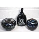 Three Ian Taylor studio art glass vases, two of ovoid form and another bottle shaped example, all