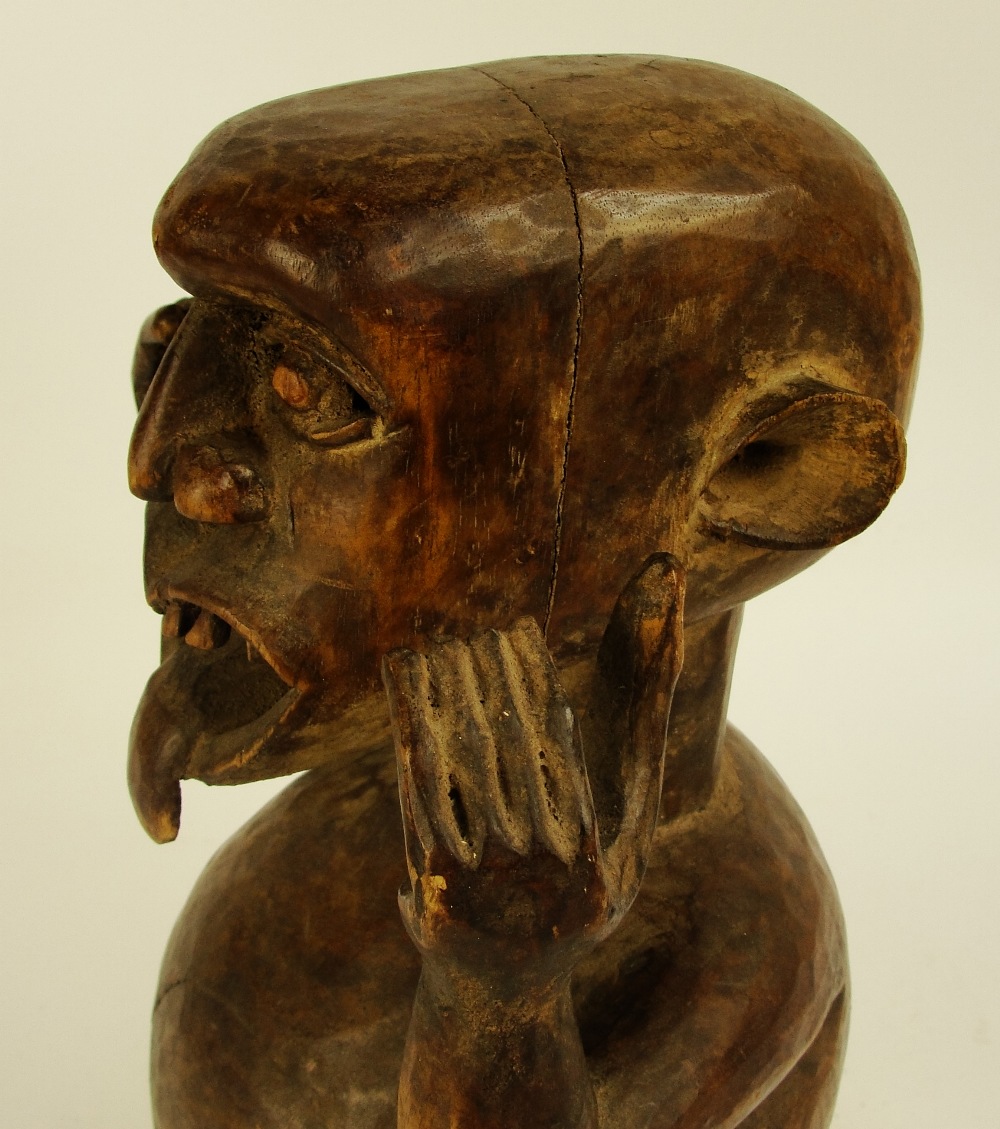 An Ibibio warning figure, Nigeria, modelled as a gent with protruding tongue, - Image 5 of 5