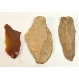 Three prehistoric flint axe heads/spear heads, length 6cm, 7cm and 7.5cm. CONDITION REPORT: