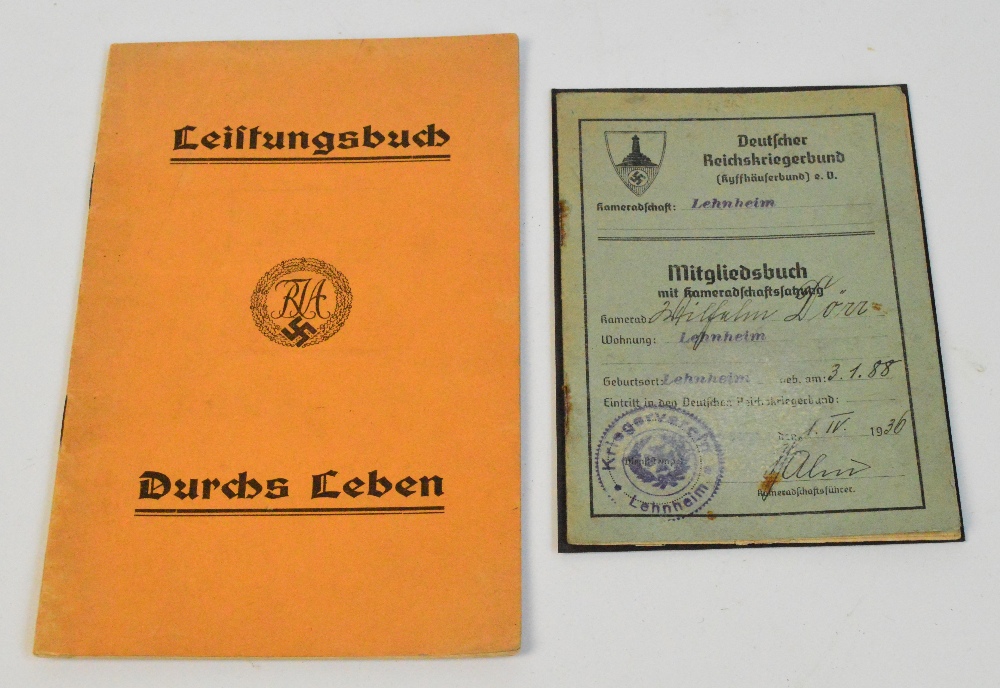 A Hitler Youth sports achievement book and a 1936 worker's stamp book (2).