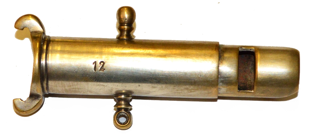 A 12 bore cartridge extractor/whistle/game dispatcher, stamped "12". Length 8.5cm.