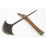 A Congolese axe with metal applied handle, shaped blade and spike, length 33cm.