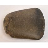 An ancient stone axe head, 6 x 6.5cm.