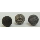 A Haskins of Hoylake gutty golf ball; a Silver Town gutty; and an Eclipse Patent gutta ball (3).