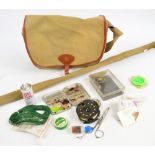A two piece Sharpe's split cane fishing rod "The Scottie", in canvas bag, a Wheatley fly tin,