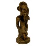 A Baule "Asie Usu" male figure, Ivory Coast, modelled with elaborate beard,