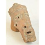 A small 19th terracotta Noc head, height 10.5cm.