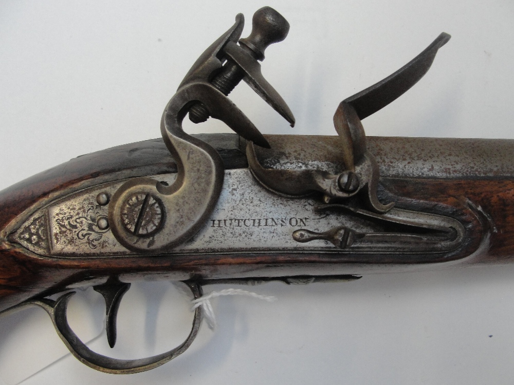 A late 18th century flintlock pistol with walnut stock, brass furniture and with side plate engraved - Image 2 of 7