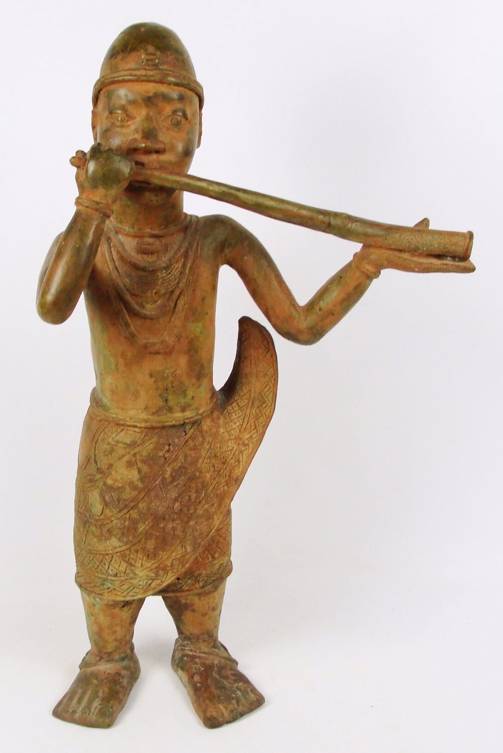 A large 17th century Benin bronze figure of Akbeki (musician to the king), height 72cm.