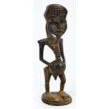 A Senufo (Poro) cult figure, Ivory Coast, height 44.75cm, width 12.5cm, depth 15cm.