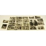 21 black and white official photographs taken in the weeks following D-Day depicting various