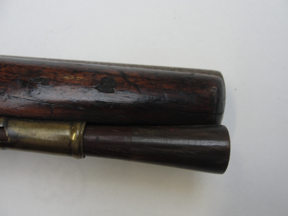 A late 18th century flintlock pistol with walnut stock and brass furniture, and face mask to the - Image 7 of 7