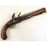 A late 18th century flintlock pistol with walnut stock, brass furniture and with side plate engraved