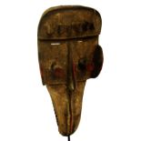 A Dan Kran hornbill mask, Ivory Coast, with raised forehead,