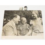 A German press photograph depicting Adolf Hitler and two young admirers, stamped "20.Aug.