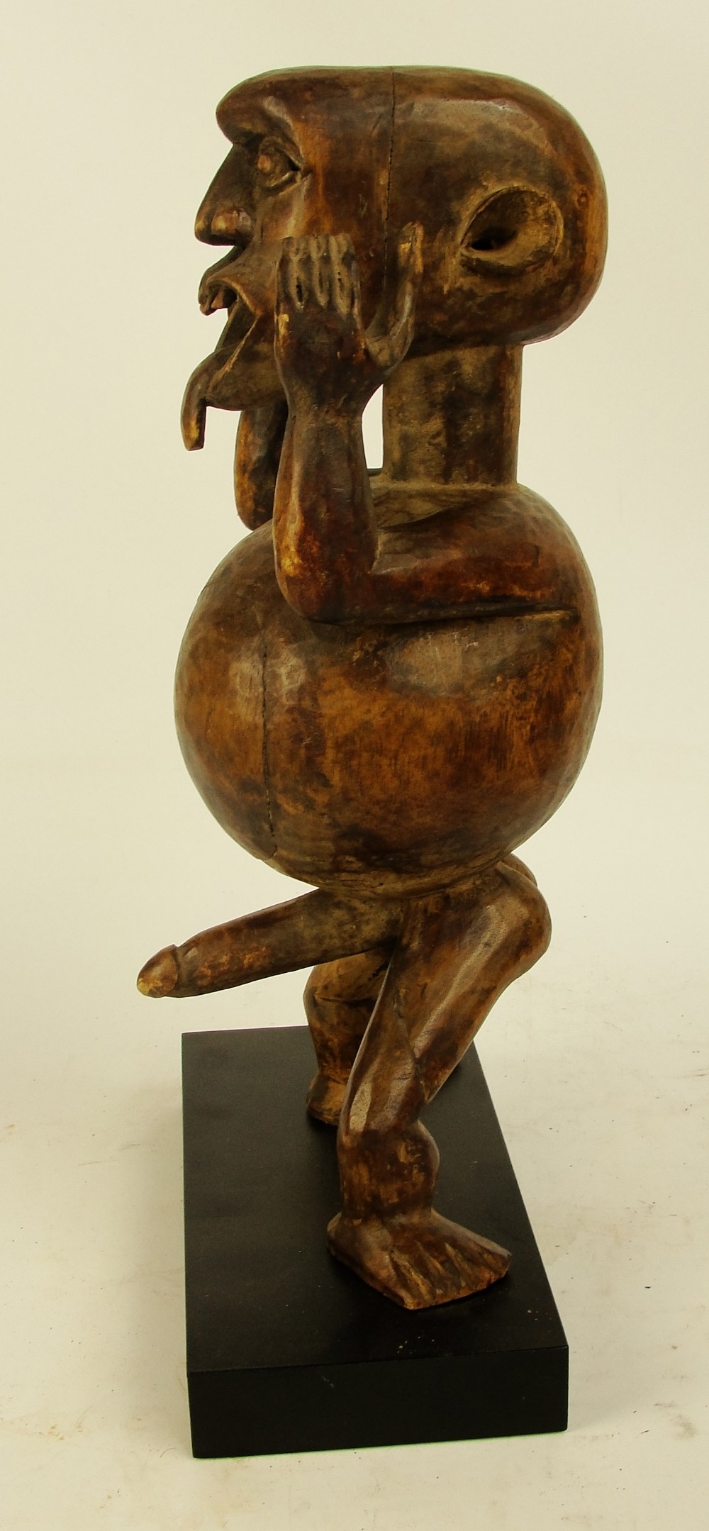 An Ibibio warning figure, Nigeria, modelled as a gent with protruding tongue, - Image 4 of 5