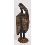 A decorative mid 20th century standing metal covered tribal bird, Tchad, height 45.5cm.