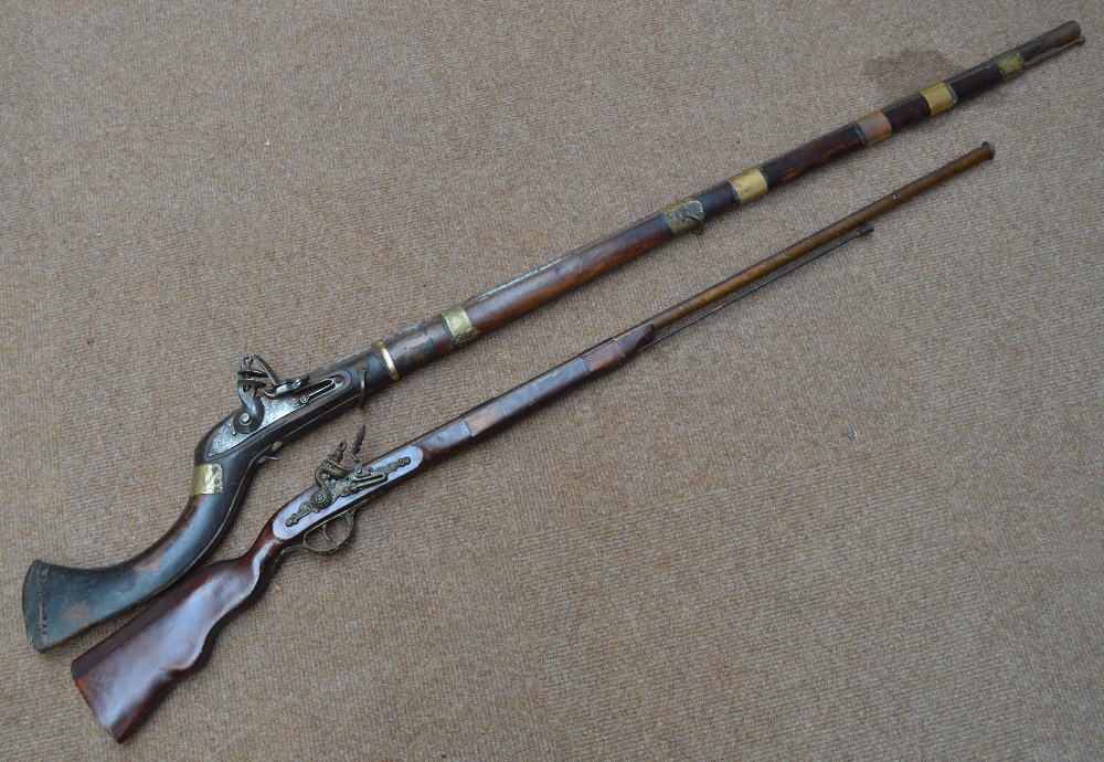 A 19th century Afghan flintlock musket with brass furniture,