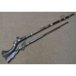 A 19th century Afghan flintlock musket with brass furniture,