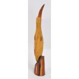 A polychrome decorated carved hardwood bird by Thomas Munkanome from Bathurst Island, Tiwi,