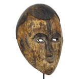 An Idoma spirit mask, Nigeria, with Western hair and traces of kaolin, height 31.5cm, width 20.