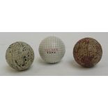 An unused Silver Town gutty golf ball, a red unnamed gutty; and another unnamed gutty (3).