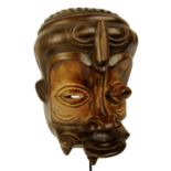 A Luluwa mask, Democratic Republic of the Congo, with exaggerated features, height 34cm, width 22cm,