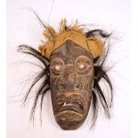 An African carved wooden tribal mask, length 33cm. CONDITION REPORT: Three of the four teeth are