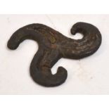 A Viking bronze triskelion belt mount, 2.5 x 2.5cm.