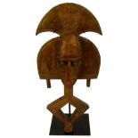 A Kota reliquary guardian figure "Umbulu Ngulu", Gabon, decorated with applied metalwork,