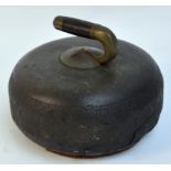 A late 19th century Scottish granite curling stone with wood and brass handle, diameter 24cm.