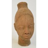 A 18th century terracotta Noc head, height 28.5cm.