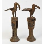 Two similar 16th century Benin bronze staffs of office surmounted with a stylised bird above