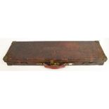 A leather and brass bound shotgun case bearing paper trade label for Holland & Holland. (Suitable