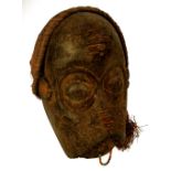 A Tschokwe (Chokwe) teacher of wisdom mask, Angola, with natural fibre plaits, covered hood,