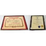 A German Third Reich certificate with gilt metal and enamel medallion, and a rifle certificate,