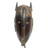 A Jimini (Djimini/Ligbi) Do or Lo society mask, Ivory Mask, height 28cm, width 12cm, depth 12.5cm.