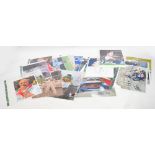 Signed photographs by various famous sports stars,