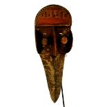 A Dan Kran hornbill mask, Ivory Coast, with protruding forehead,