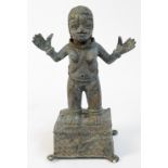 An 18th century Benin bronze standing figure of a female with both hands raised aloft and set on a