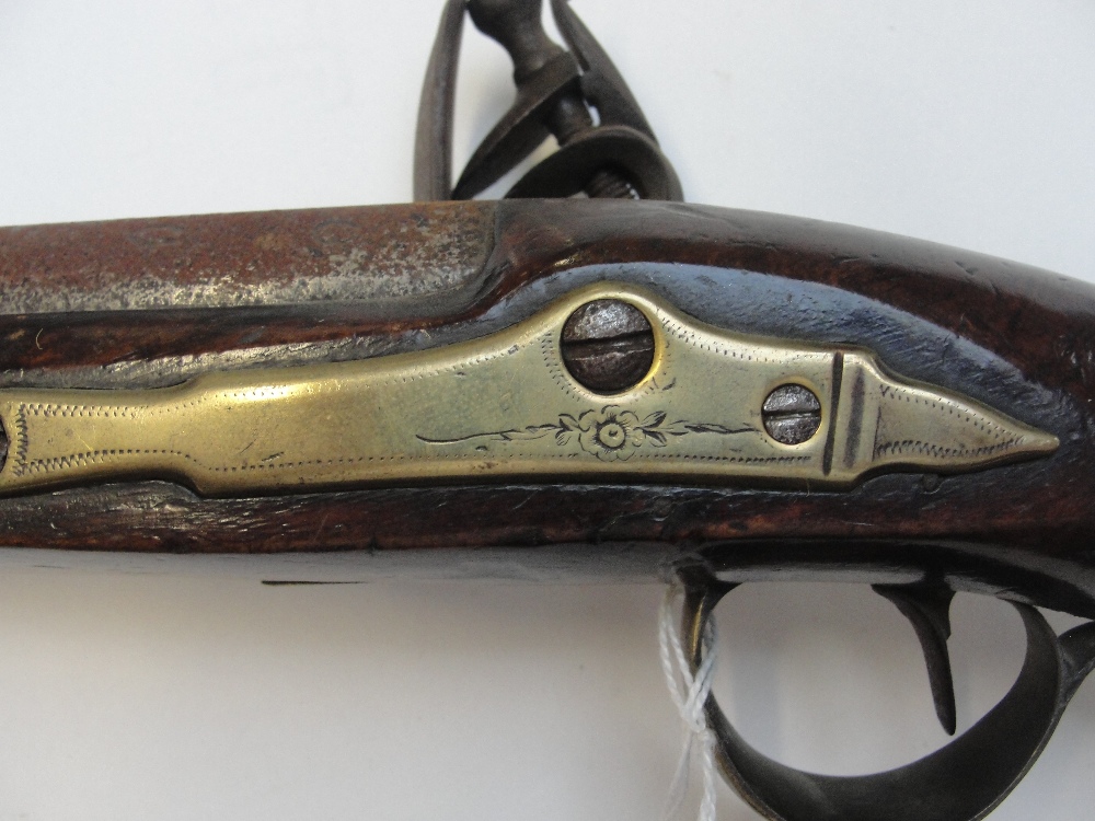 A late 18th century flintlock pistol with walnut stock and brass furniture, and face mask to the - Image 3 of 7